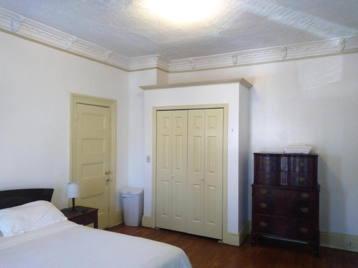 Homestay Mini Mansion Near Public Transportation Is The Yellow And House On The Corner Of 8th St And Madison Avenue