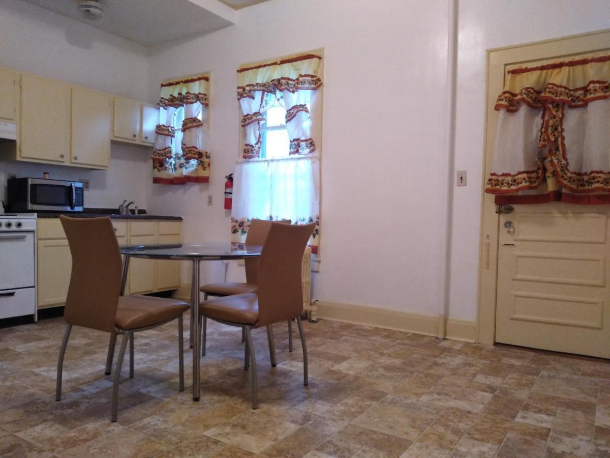 Homestay Mini Mansion Near Public Transportation Is The Yellow And House On The Corner Of 8th St And Madison Avenue