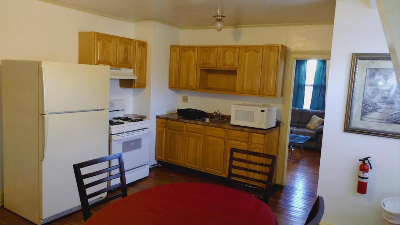 Homestay Mini Mansion Near Public Transportation Is The Yellow And House On The Corner Of 8th St And Madison Avenue