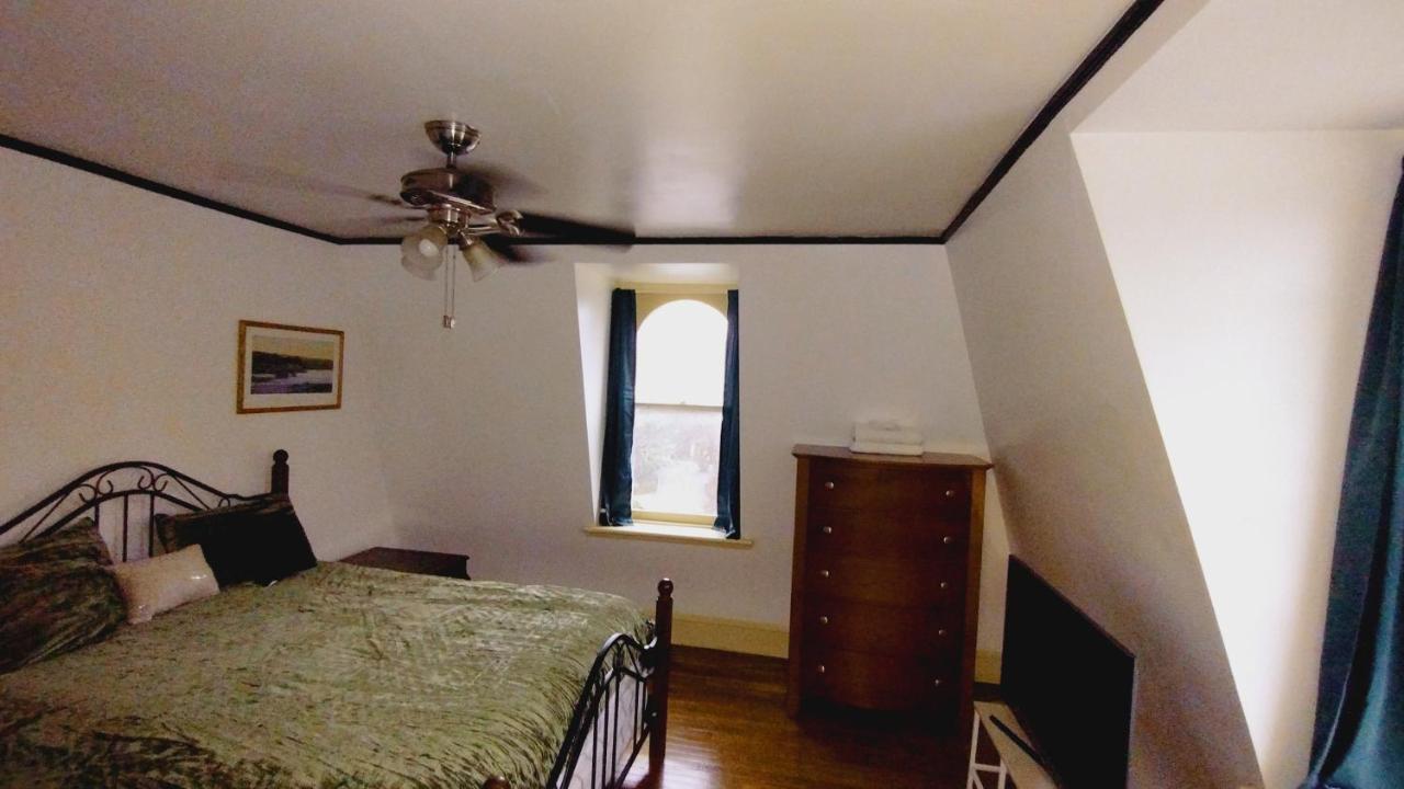 Homestay Mini Mansion Near Public Transportation Is The Yellow And House On The Corner Of 8th St And Madison Avenue