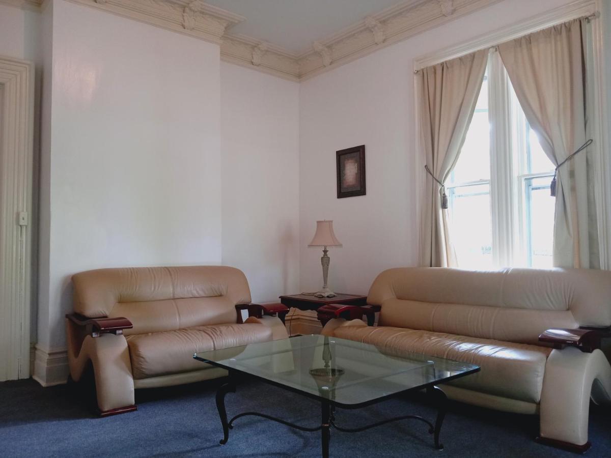 Homestay Mini Mansion Near Public Transportation Is The Yellow And House On The Corner Of 8th St And Madison Avenue